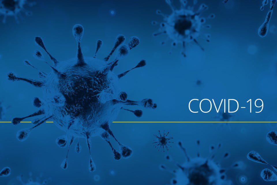 Virus particles illustration related to COVID-19 in blue tones.