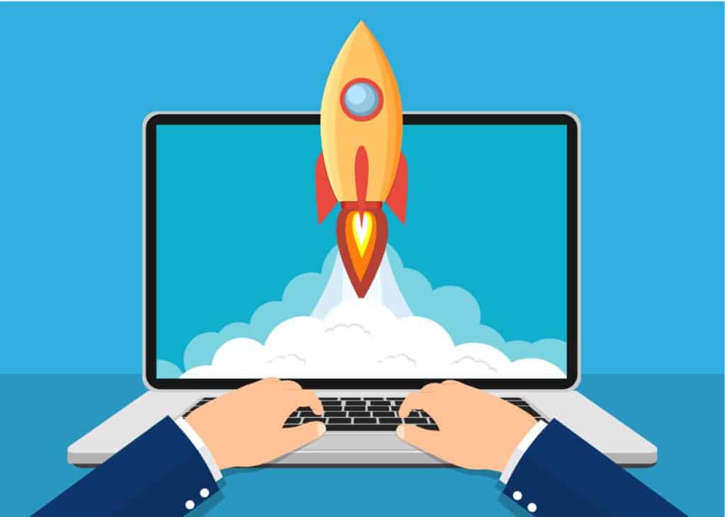 Rocket launching from laptop screen symbolizing website growth and digital innovation.