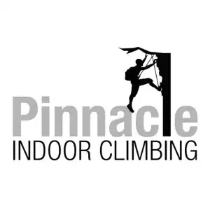 Climber scaling indoor wall at Pinnacle Indoor Climbing gym, offering recreational and fitness climbing in Oshawa, Durham Region, Bowmanville, Ontario, Canada.